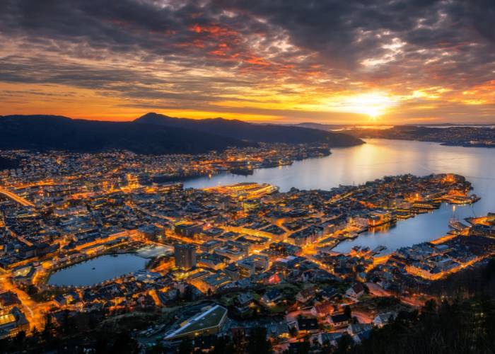 The midnight sun illuminates the sky over Bergen, Norway, creating a unique and magical atmosphere on long summer nights.