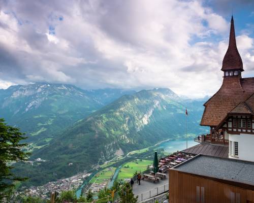 The summit of the Harder Kulm at 1322 meters above sea level in Switzerland, overlooking Interlaken and its two lakes, with the Bernese Alps. On the left is Lake Thun, and on the right Lake Brienz. In the center, the town of Interlaken