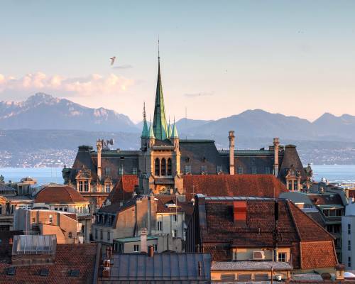 Panoramic view of Lausanne, a Swiss city on the shores of Lake Geneva, with the Alps in the background