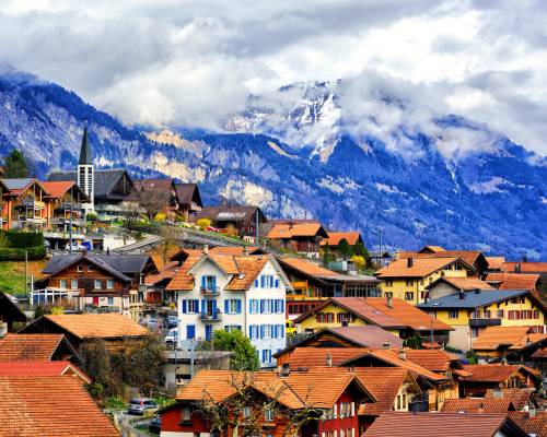 View of the old town of Interlaken, Switzerland, with the head of the snow-covered Bernese Alps